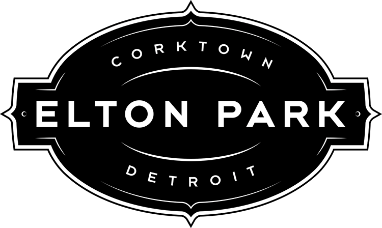 a black and white logo on a green background